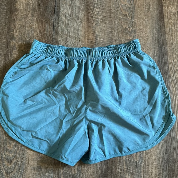 Teal Nike running shorts. Smoke free, pet friendly home. - Picture 2 of 3